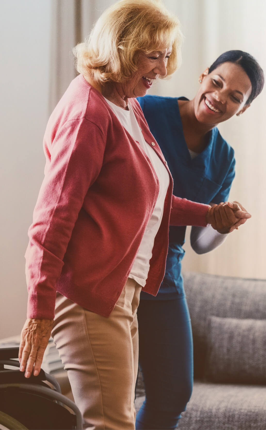 Nurse-helping-woman-stand.9dcfecbc